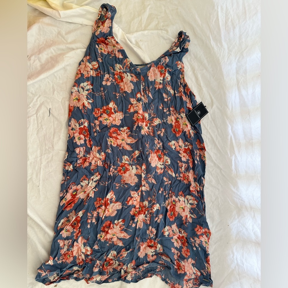 Women’s summer button down dress - tag says large but is very small.